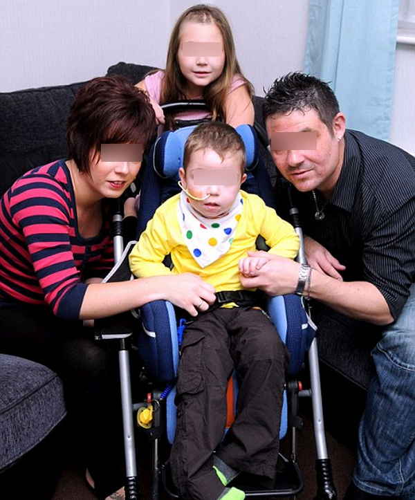A child with a Batten disease is on a wheelchair to ease mobility picture photo image