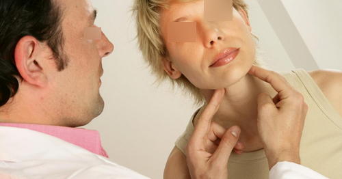 The doctor is performing a physical examination on the patient’s neck area image photo picture