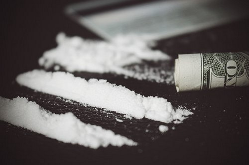A cocaine is a white, crystalline substance illegally sold in the street, known for its street name “crack” image photo picture
